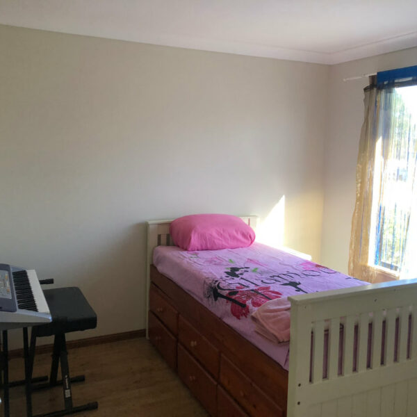 Bedroom with a window and a keyboard