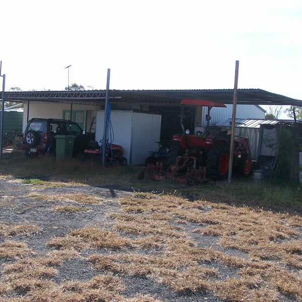 Garage with cars and tractor